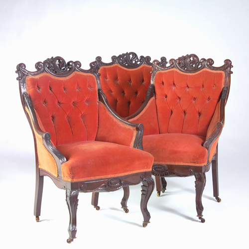 Appraisal: Three American Victorian mahogany armchairs each with scrolled and floral