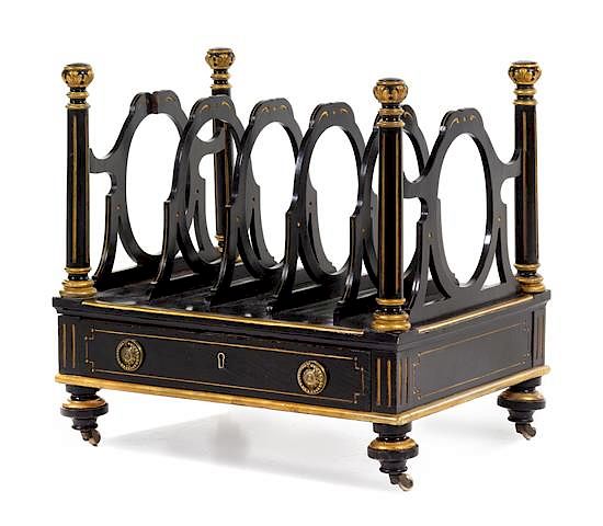 Appraisal: A Continental Ebonized and Parcel Gilt Canterbury Height x width