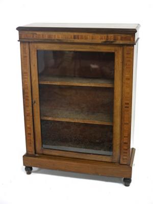 Appraisal: A Victorian walnut and inlaid pier cabinet with a glazed