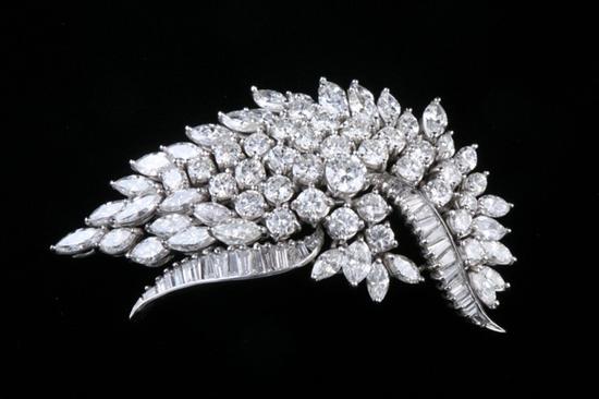 Appraisal: PLATINUM AND DIAMOND STYLIZED LEAF DESIGN PIN PENDANT Low-domed curving