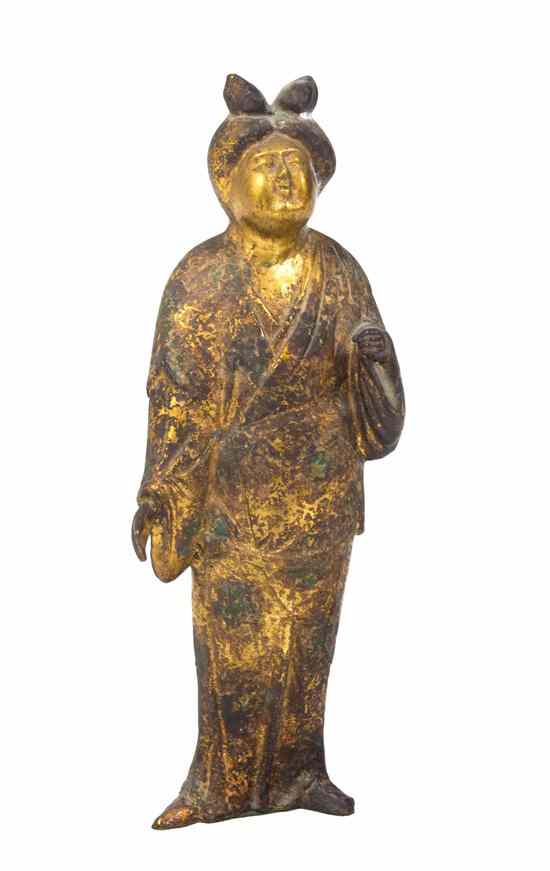 Appraisal: A Japanese Parcel Gilt and Patinated Figure depicting a standing