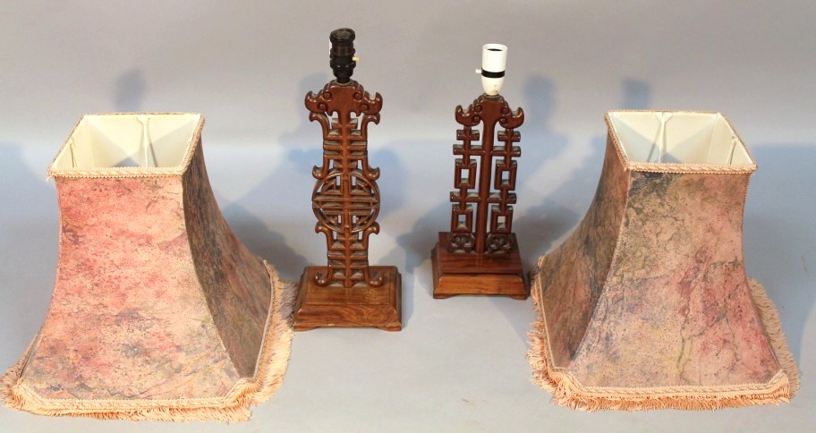 Appraisal: Two Chinese rosewood table lamps with shades