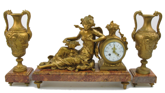 Appraisal: A FRENCH PIECE FIGURAL CLOCK AND GARNITURE SET the clock