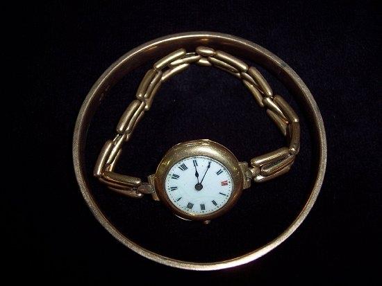 Appraisal: A ct gold bangle and a ladies gold wrist watch