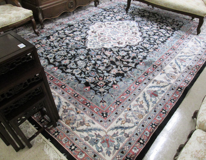 Appraisal: HAND KNOTTED ORIENTAL CARPET Indo-Persian floral and central floral medallion