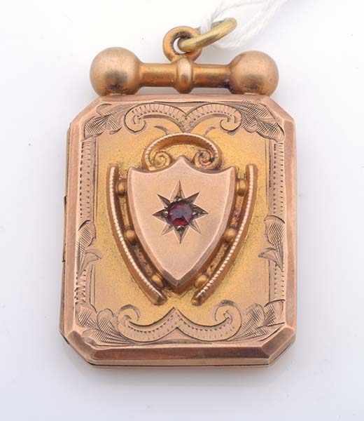 Appraisal: A PHOTO LOCKET WITH A RED STONE STAMPED CT GOLD