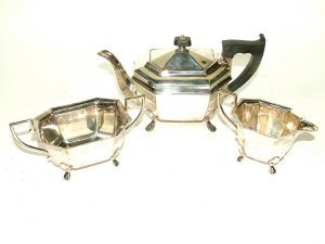 Appraisal: A silver three piece tea set of fluted hexagonal form