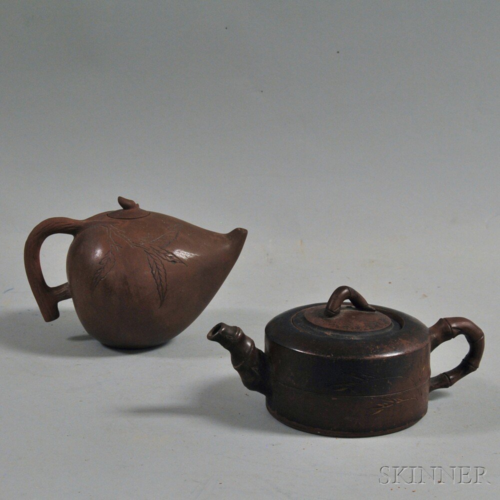 Appraisal: Two Chinese Yixing Pottery Teapots th th century one in