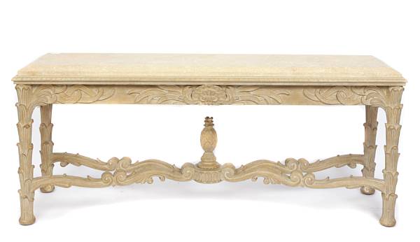 Appraisal: A large carved pickled oak console table with limestone top