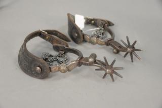 Appraisal: Pair of cast iron Western Cowboy spurs with silver inlay