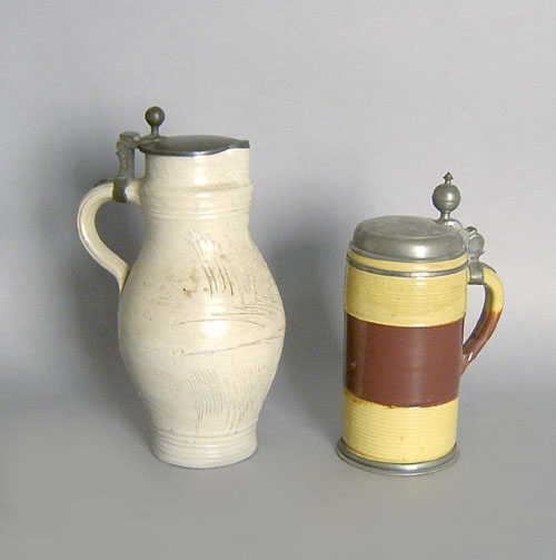 Appraisal: Two German stoneware steins th th c h h