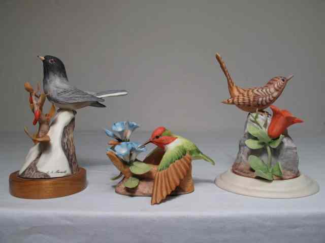 Appraisal: Three Moussalli porcelain bird figurines One depicts a bird on