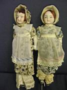 Appraisal: TWO PRAIRIE GIRL DOLLS Porcelain heads and feet both are