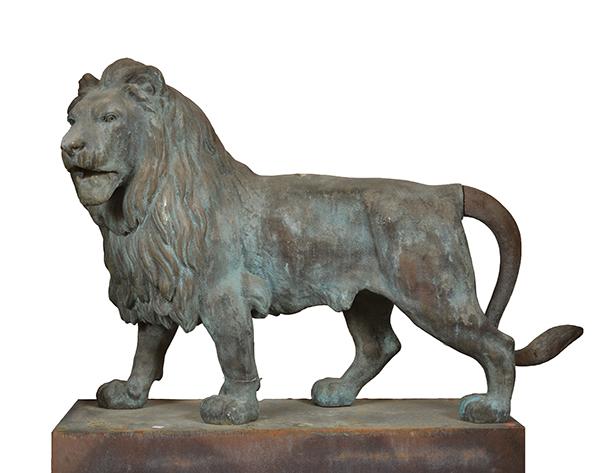 Appraisal: A PAIR OF COMPOSITE LIONS ON STANDS each standing figure