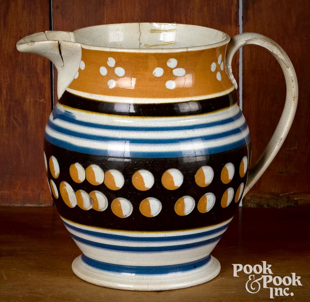 Appraisal: Mocha pitcher with cat's-eye decoration Mocha pitcher with cat's-eye decoration