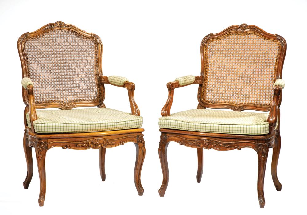 Appraisal: Two Antique Louis XV-Style Carved Fruitwood Fauteuils shaped floral carved