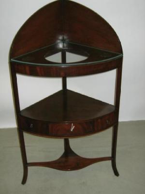 Appraisal: A GEORGE III MAHOGANY CORNER WASHSTAND of three tier form