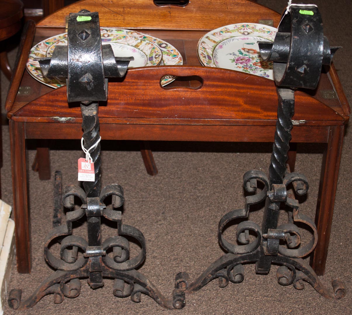 Appraisal: Pair of Arts Crafts wrought iron andirons Condition Wear from