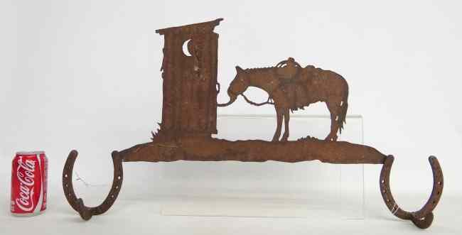 Appraisal: Folk art sheet and cast iron clothes hanger with horse