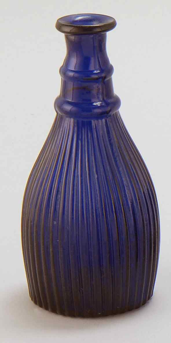 Appraisal: EARLY SANDWICH COBALT BLUE GLASS BITTERS BOTTLE With ribbed body