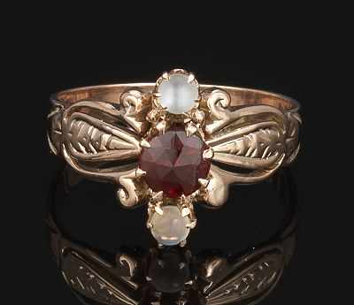 Appraisal: A Victorian Ladies' Ring with Moonstones and Garnet Rose gold