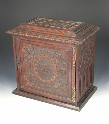 Appraisal: A Victorian carved oak collector's cabinet the top and sides