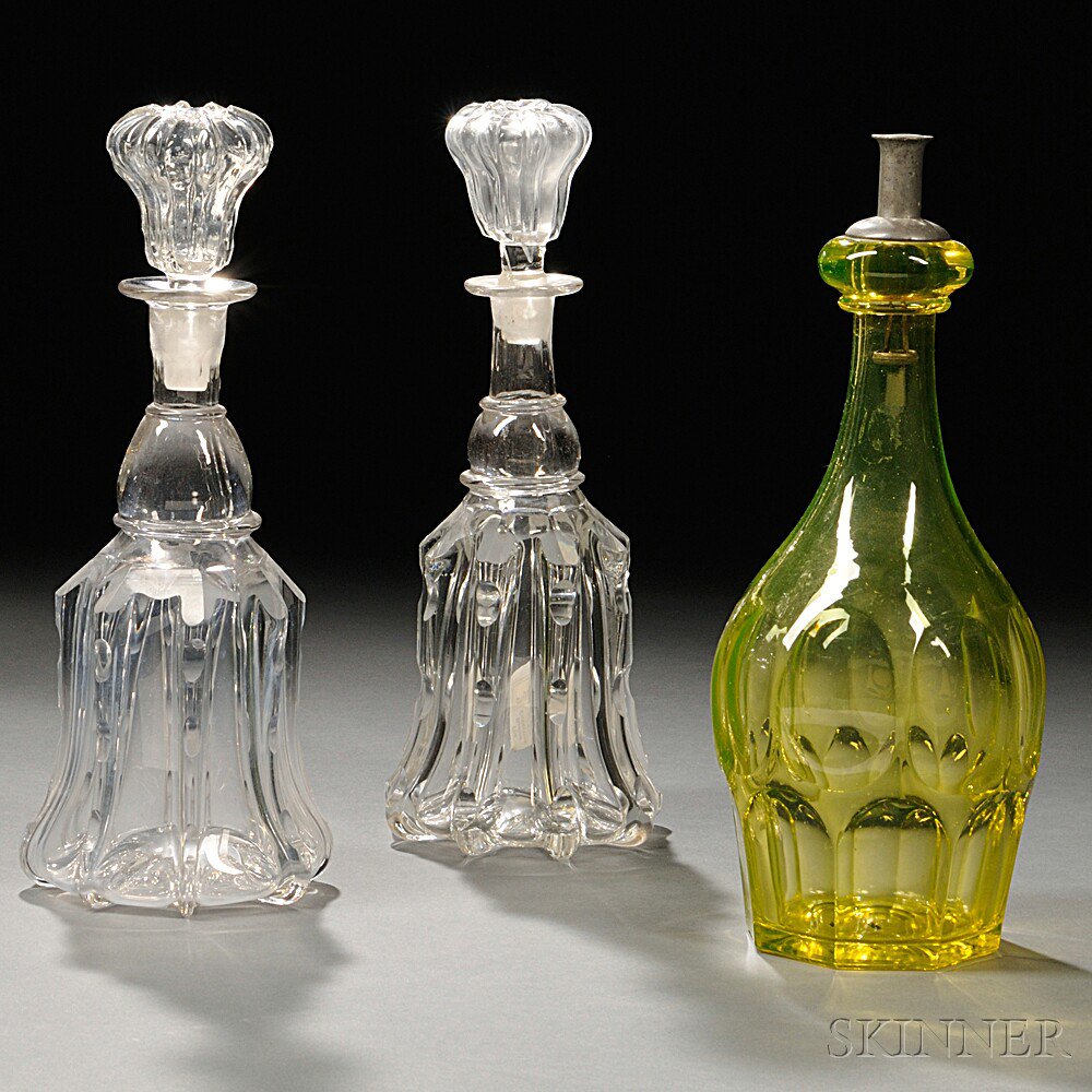 Appraisal: Three Pieces of Glass Tableware two colorless decanters each cut