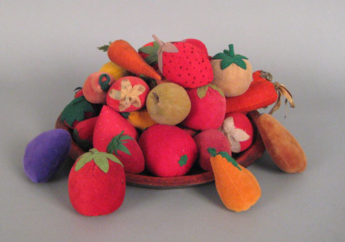 Appraisal: Large collection of velvet fruit together with a turned tray