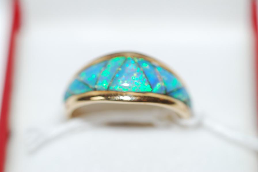 Appraisal: AN OPAL DRESS RING IN CT GOLD AN OPAL DRESS