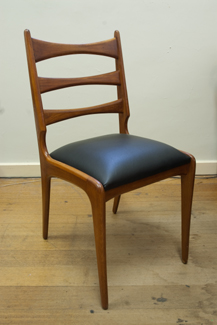 Appraisal: FOUR s TIMBER AND BLACK VINYL UPHOLSTERED CHAIRS