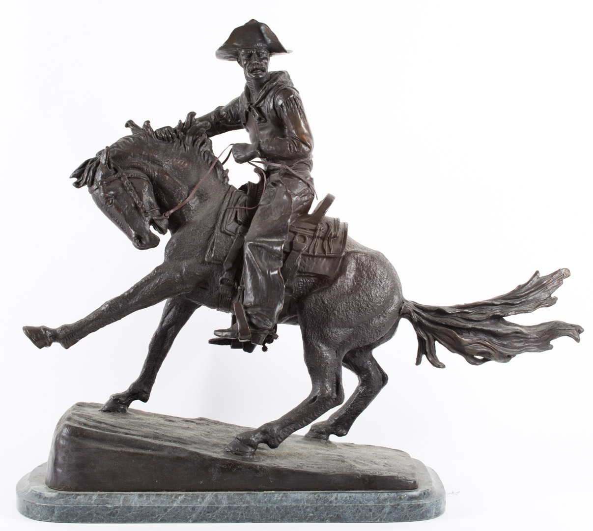 Appraisal: After Remington Cowboy bronze mounted on marble base in H