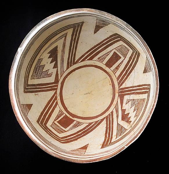 Appraisal: A Mimbres red-on-white bowl A four-section linear design around the