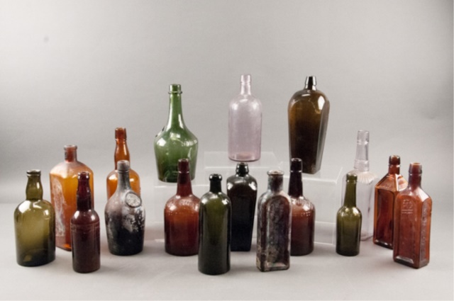 Appraisal: Assortment of Seventeen Glass Bottles Varying shades of brown green