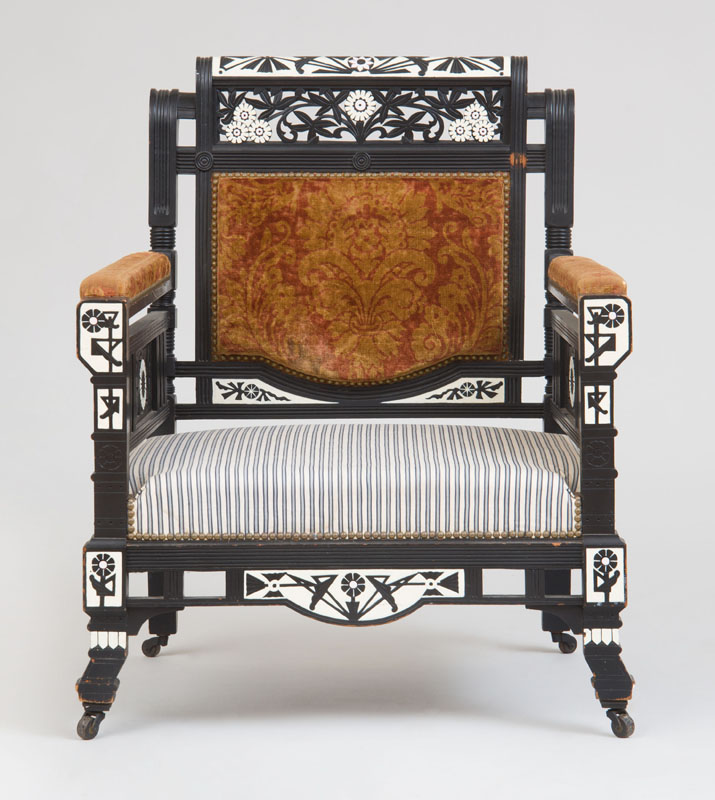 Appraisal: AESTHETIC MOVEMENT ARMCHAIR Ebonized finish carved and incised decoration upholstery