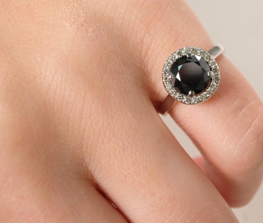 Appraisal: k white gold ring having round cut black center diamond