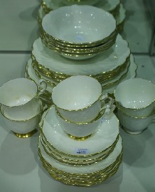 Appraisal: An Aynsley bone china part dinner service in the 'Golden