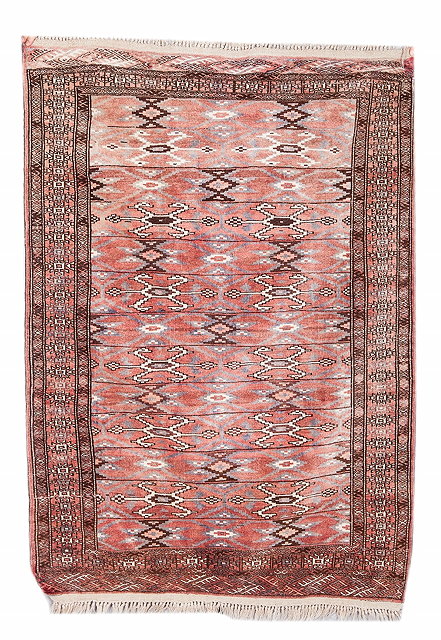 Appraisal: A PERSIAN YOMUT PALE RED GROUND RUG with stylistic decoration