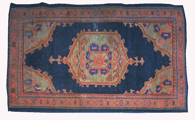 Appraisal: A Caucasian blue ground rugwith central medallion and multiple geometric