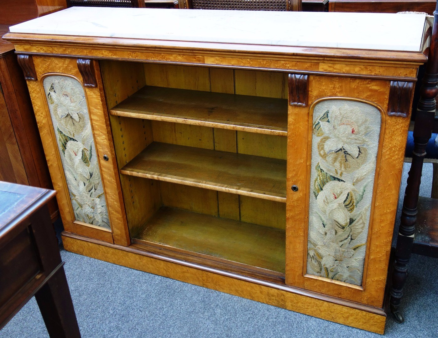 Appraisal: A Victorian blonde birdseye maple side cabinet with marble top