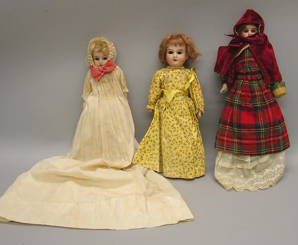 Appraisal: Lot of dolls Pair of shoulderhead dolls with leather bodies