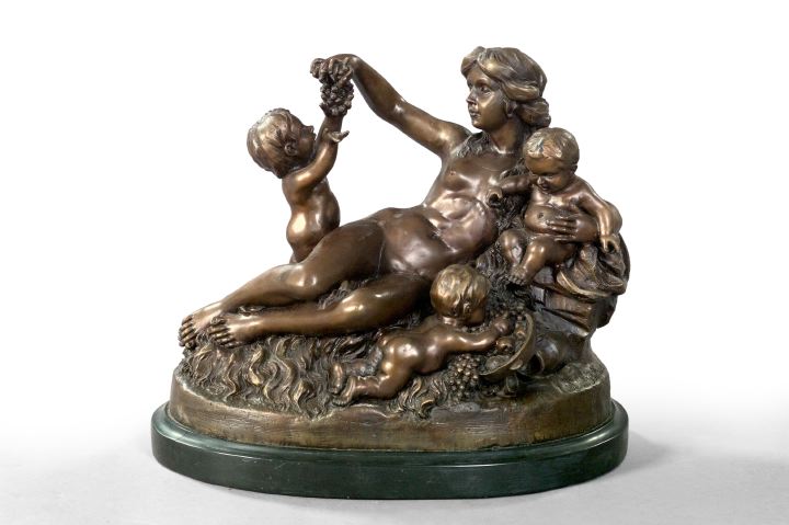 Appraisal: Wood Nymph Attended by Bacchic Putti a French patinated bronze