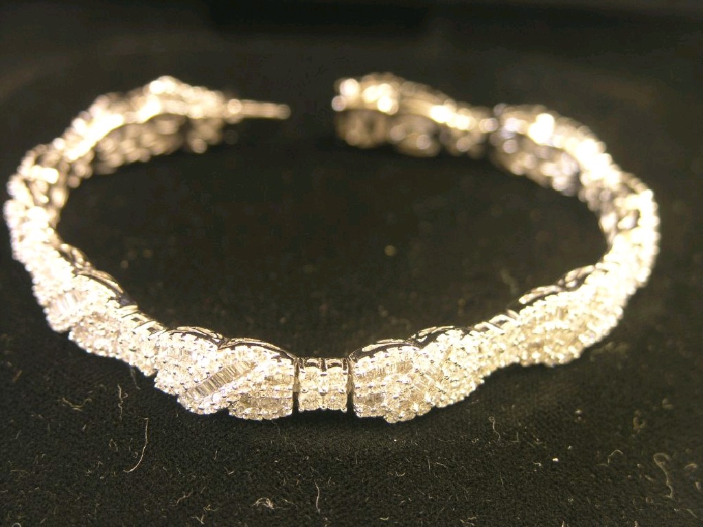 Appraisal: An ct white gold and diamond bracelet the whole set