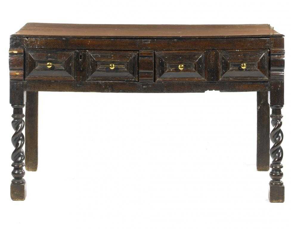 Appraisal: A WILLIAM III OAK DRESSER with boarded top and twin