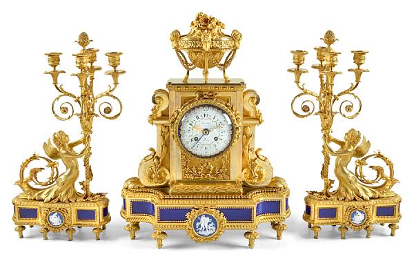 Appraisal: A Louis XVI style gilt bronze porcelain mounted clock garniture