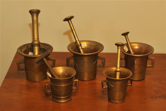 Appraisal: FIVE BRASS MORTARS AND PESTLES American or Continental th century