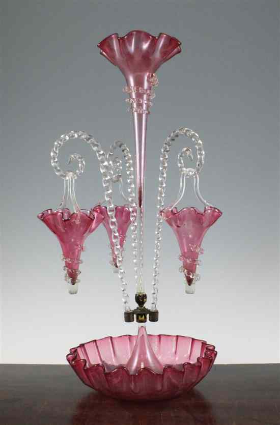 Appraisal: A Victorian cranberry glass epergne with central trumpet shaped vase