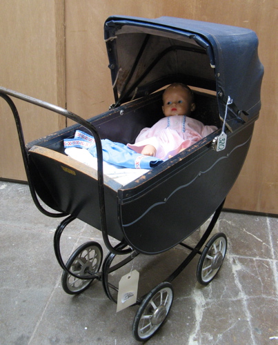 Appraisal: DOLL DOLL BUGGY AND ACCESSORIES The doll of hard rubber