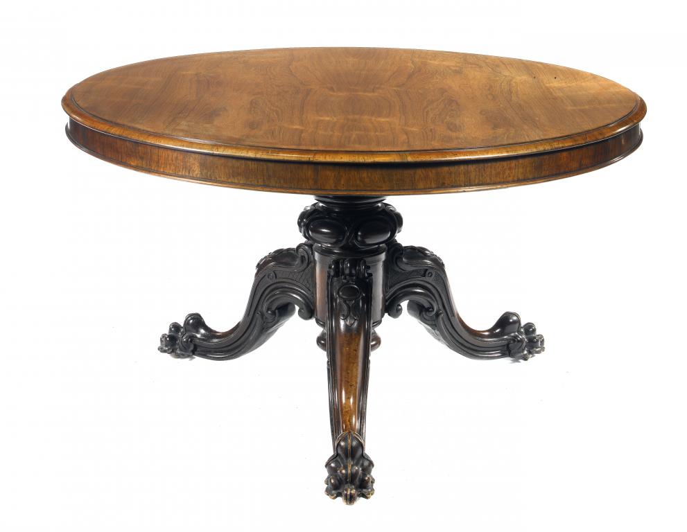 Appraisal: A VICTORIAN ROSEWOOD BREAKFAST TABLE the figured circular top on