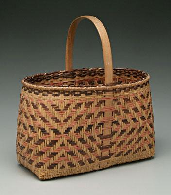 Appraisal: Cherokee river cane basket brown and faded red weavers concentric