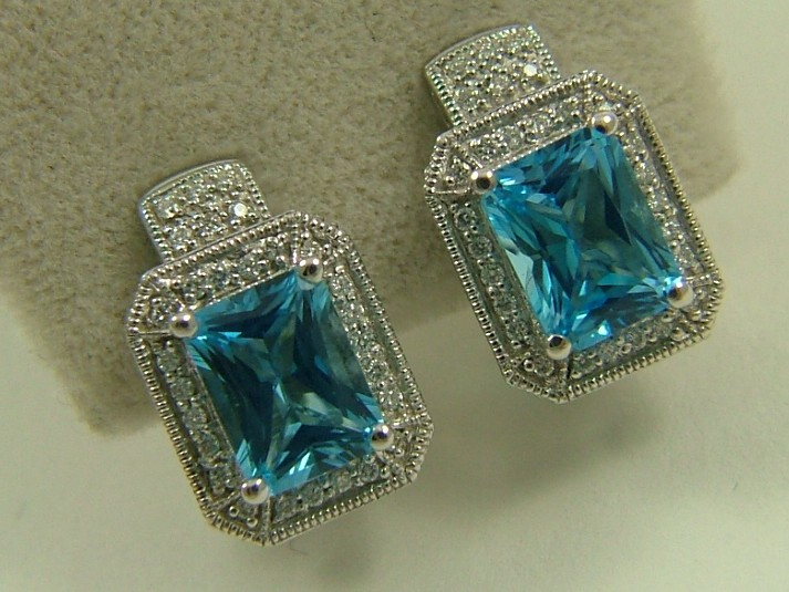 Appraisal: PAIR OF BLUE TOPAZ AND DIAMOND EARRINGS each K white